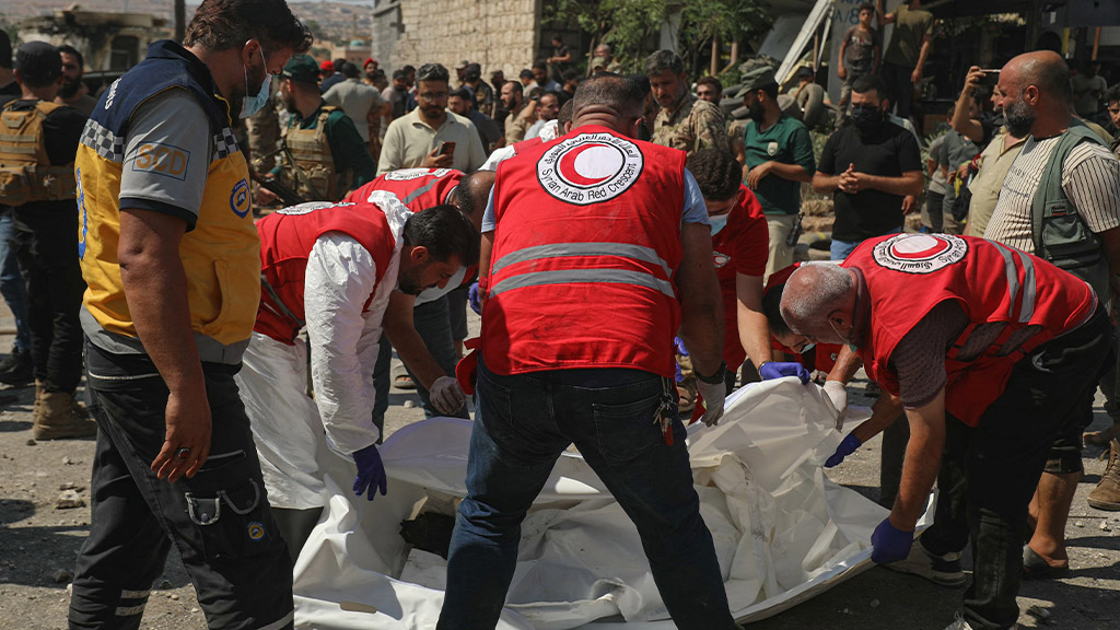 At least 14 killed in explosion at weapons depot in Syria
