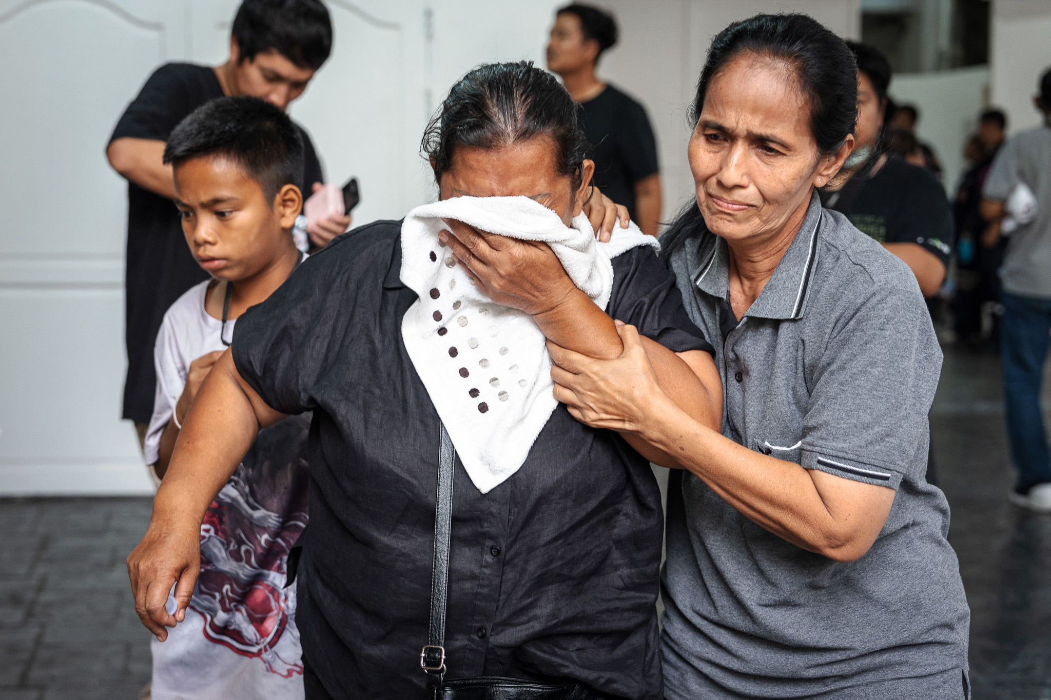 Families claim bodies as Bangkok fire toll rises to 30